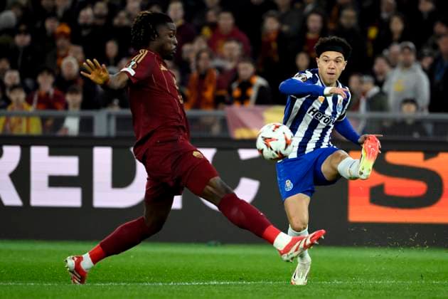 Kouadio Kone of AS Roma and Eduardo Gabriel Aquino Cossa of FC Porto during the Europa League football match between AS Roma and FC Porto at Olimpico stadium in Rome (Italy), February 20, 2025. andreaxstaccioli