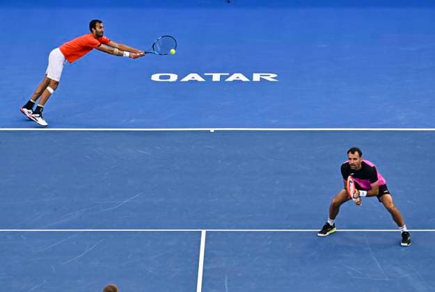 ATP, Tennis Herren QATAR EXXONMOBIL OPEN Yuki Bhambri of India and Ivan Dodig of Croatia compete during men s doubles Semifinals match against Ulian Cash and Lloyd Glasspool of Great Britain at the ATP Qatar ExxonMobil Open 2025 tennis tournament at the Khalifa International Tennis Complex in Doha, Qatar on February 21, 2025. DOHA Qatar Copyright: xNOUSHADx