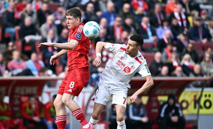 Fussball, Bundesliga, Deutschland, Herren, Saison 2024 2025, 23. Spieltag, Rhein Energie Stadion Köln, 1. FC Köln - Fortuna Düsseldorf; Isak Bergmann Johannesson (F95), Dejan Ljubicic (KOE). Aktion
