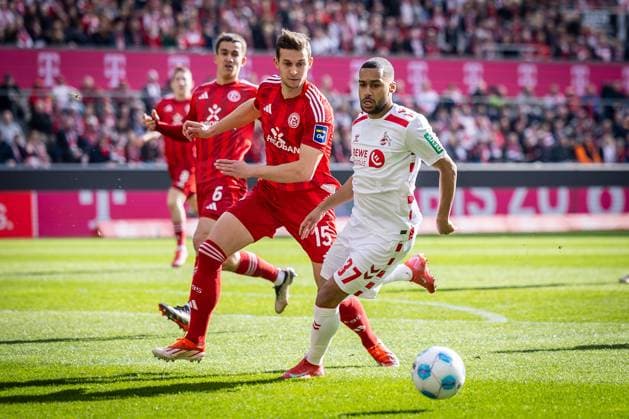 2. Fußball Bundesliga: 1. FC Köln - Fortuna Düsseldorf, 23.02.2025 Tim Oberdorf (Fortuna Düsseldorf, 15) und Linton Maina (1. FC Köln, 37) im Zweikampf; Köln, 23.02.2025 - 1. FC Köln - Fortuna Düsseldorf 23. Spieltag der 2. Fussball-Bundesliga: , 1. FC Köln - Fortuna Düsseldorf in der Rhein-Energie-Stadion in Köln. DFL REGULATIONS PROHIBIT ANY USE OF PHOTOGRAPHS AS IMAGE SEQUENCES AND OR QUASI-VIDEO.