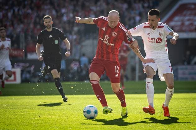 2. Fußball Bundesliga: 1. FC Köln - Fortuna Düsseldorf, 23.02.2025 Valgeir Lunddal (Fortuna Düsseldorf, 12) und Dejan Ljubicic (1. FC Köln, 7) im Zweikampf; Köln, 23.02.2025 - 1. FC Köln - Fortuna Düsseldorf 23. Spieltag der 2. Fussball-Bundesliga: , 1. FC Köln - Fortuna Düsseldorf in der Rhein-Energie-Stadion in Köln. DFL REGULATIONS PROHIBIT ANY USE OF PHOTOGRAPHS AS IMAGE SEQUENCES AND OR QUASI-VIDEO.