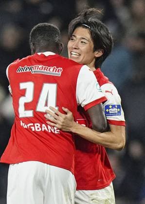 Football: French Cup Keito Nakamura (R) of Reims celebrates with teammate Mory Gbana after scoring in the second half of a French Cup football quarterfinal match against Angers on Feb. 25, 2025, in Angers, France.  A14AA0004211572P