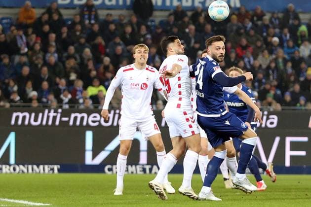 01.03.2025, xrekx, Fussball 2.Bundesliga, Karlsruher SC - 1.FC Köln v.l. Jusuf Gazibegovic (1.FC Koeln) Fabian Schleusener (Karlsruher SC) Zweikampf, Aktion, action, battle for the ball (DFL DFB REGULATIONS PROHIBIT ANY USE OF PHOTOGRAPHS as IMAGE SEQUENCES and or QUASI-VIDEO) Karlsruhe