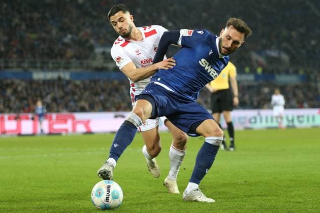 01.03.2025, xrekx, Fussball 2.Bundesliga, Karlsruher SC - 1.FC Köln v.l. Jusuf Gazibegovic (1.FC Koeln) Fabian Schleusener (Karlsruher SC) Zweikampf, Aktion, action, battle for the ball (DFL DFB REGULATIONS PROHIBIT ANY USE OF PHOTOGRAPHS as IMAGE SEQUENCES and or QUASI-VIDEO) Karlsruhe