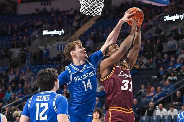 MARCH 01, 2025: Saint Louis Billikens forward Kilian Brockhoff (14) blocks the shot attempt of Loyola (Il) Ramblers forward Zachary Royster (31) in a regular season game where the Loyola Chicago Ramblers visited the Saint Louis Billikens. Held at Chaifetz Arena in St. Louis, MO on Saturday March 01, 2025 CSM St. Louis United States of America - ZUMAc04_ 20250301_zma_c04_182 Copyright: xRichardxUlreichx