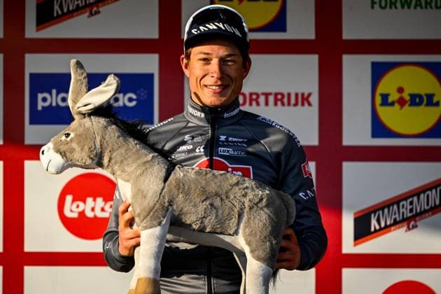 Belgian Jasper Philipsen of Alpecin-Deceuninck celebrates on the podium after winning the Kuurne-Brussels-Kuurne one day cycling race, 196,9 km from Kuurne to Kuurne via Brussels, Sunday 02 March 2025. ERICxLALMAND  x114026886x