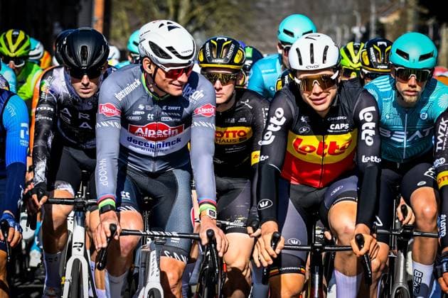 Dutch Mathieu van der Poel of Alpecin-Deceuninck and Belgian Arnaud De Lie of Lotto Cycling Team pictured at the start of the Ename Samyn Classic one day cycling race, 199,1km from Quaregnon to Dour on Tuesday 04 March 2025. TOM GOYVAERTS TomxGoyvaerts  x114212936x