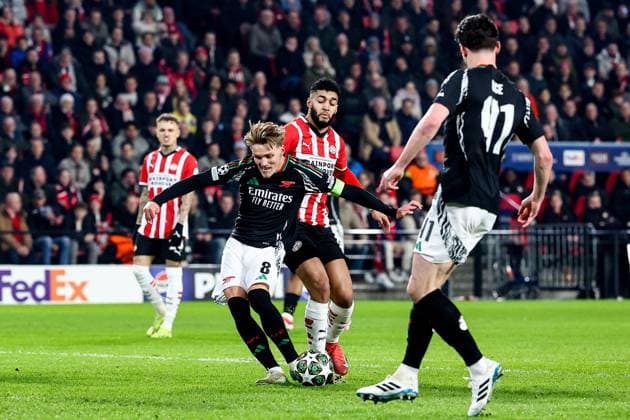 EINDHOVEN, 04-03-2025, Philips Stadium, UEFA Champions League season 2024 25, match between PSV and Arsenal, Arsenal player Martin Odegaard in action with PSV player Ismael Saibari during the match PSV - Arsenal PSV - Arsenal  x28168493x Copyright: