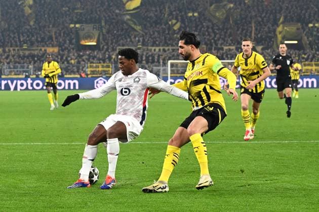 Jonathan David (Lille OSC) und Emre Can (Borussia Dortmund) battle for the ball during the UEFA Champions League 2024 25 Round of 16 First Leg match between Borussia Dortmund and LOSC Lille at Signal Iduna Park on March 4, 2025 in Dortmund, Germany. (Photo by Ralf Treese DeFodi Images)