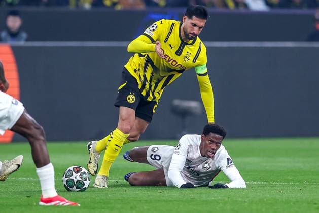 04.03.2025, Fußball, UEFA Champions League, Borussia Dortmund - OSC Lille, Signal Iduna Park, Runde der 16, Saison 2024 2025: Emre Can (BVB 23) im Zweikampf gegen Jonathan David (LOSC Lille 9) Nordrhein-Westfalen Deutschland