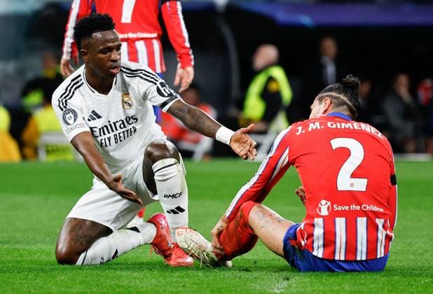 Vinicius Junior of Real Madrid and Josà Gimà nez of Atletico Madrid Real Madrid v Atletico Madrid , UEFA Champions League, Round of 16, First Leg, Football, Santiago Bernabeu, Madrid, Spain - 04 Mar 2025 EDITORIAL USE ONLY No use with unauthorised audio, video, data, fixture lists, club league logos or live services. Online in-match use limited to 120 images, no video emulation. No use in betting, games or single club league player publications. Copyright: xRubenxAlbarran Shutterstockx 15178301bf