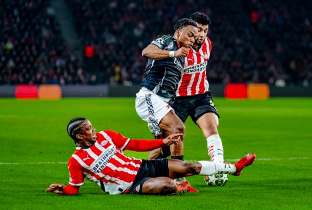 PSV Eindhoven defender Tyrell Malacia, Arsenal defender Jurrien Timber, PSV Eindhoven midfielder Ismael Saibari during the match PSV - Arsenal at the Philips stadium for the UEFA Champions League- Round of 16 - 1st leg season 2024-2025 in EINDHOVEN, Netherlands on 4 march 2025, (photo by Marcel van Dorst EYE4images DeFodi Images)