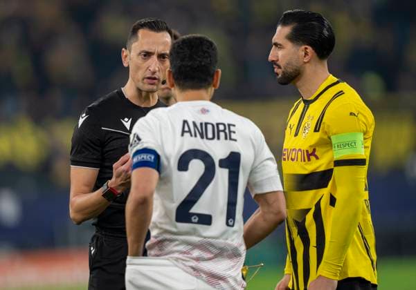 Jose Maria Sanchez Martinez (Referee, Spain) diskutiert mit Benjamin Andre (OSC Lille, 21) und Emre Can (Borussia Dortmund, 23) Borussia Dortmund vs. OSC Lille, Fussball, UEFA Champions League, Round of 16, Saison 2024 2025, 04.03.2025 DFL regulations prohibit any use of photographs as image sequences and or quasi-video. Copyright: HMBxMedia xMarcoxBader