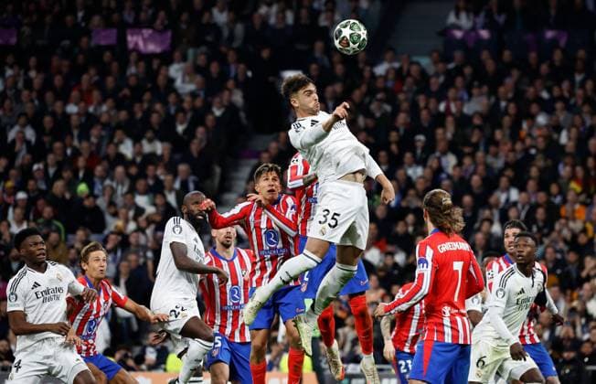 Raul Asencio of Real Madrid Real Madrid v Atletico Madrid , UEFA Champions League, Round of 16, First Leg, Football, Santiago Bernabeu, Madrid, Spain - 04 Mar 2025 EDITORIAL USE ONLY No use with unauthorised audio, video, data, fixture lists, club league logos or live services. Online in-match use limited to 120 images, no video emulation. No use in betting, games or single club league player publications. Copyright: xRubenxAlbarran Shutterstockx 15178301cl