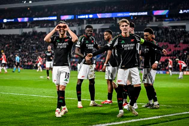 Arsenal midfielder Leandro Trossard, Arsenal midfielder Martin Odegaard celebrating the goal 1-5, during the match PSV - Arsenal at the Philips stadium for the UEFA Champions League- Round of 16 - 1st leg season 2024-2025 in EINDHOVEN, Netherlands on 4 march 2025, (photo by Stefan Koops EYE4images DeFodi Images)