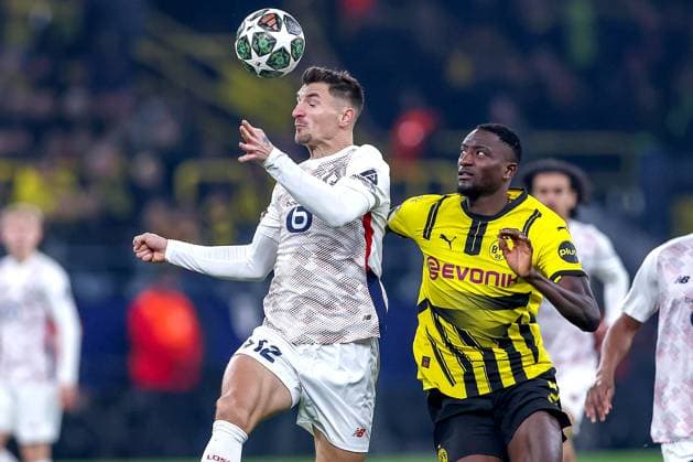 04.03.2025, Fußball, UEFA Champions League, Borussia Dortmund - OSC Lille, Signal Iduna Park, Runde der 16, Saison 2024 2025: Thomas Meunier (LOSC Lille 12) im Zweikampf gegen Serhou Guirassy (BVB 9) Nordrhein-Westfalen Deutschland