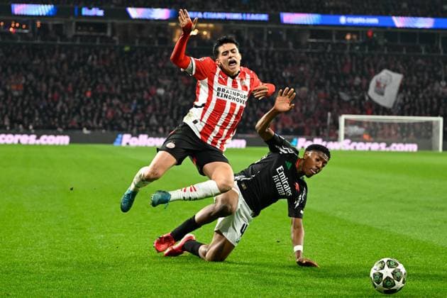 PSV Eindhoven v Arsenal Champions League 04 03 2025. Arsenal forward Osman Kamara (48) makes a tackle on PSV Eindhoven midfielder Richard Ledezma (37) during the Champions League match between PSV Eindhoven and Arsenal at Philips Stadion, Eindhoven, Netherlands on 4 March 2025. Eindhoven Philips Stadion Endhoven Netherlands Editorial use only , Copyright: xSimonxTraylenx PSI-21570-0047