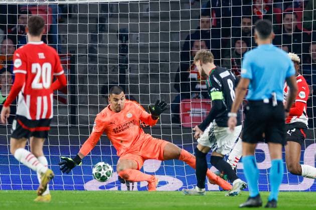 Walter Benitez of PSV Eindhoven, Martin Odegaard Arsenal FC scores the 1-4 , UEFA Champions League 2024 25 Round of 16 First Leg, PSV Eindhoven v Arsenal FC, Philips Stadion, March 4, 2025, Eindhoven, Netherlands.