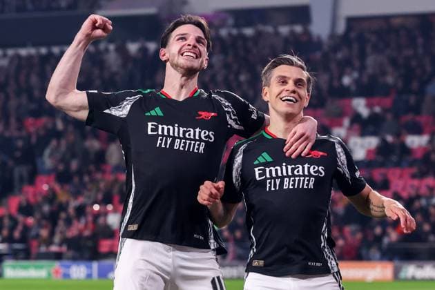 2025-03-04 PSV v Arsenal FC - UEFA Champions League 2024 25 Round of 16 First Leg EINDHOVEN, NETHERLANDS - MARCH 4: Leandro Trossard of Arsenal FC celebrates after scoring his teams fifth goal, Declan Rice during the UEFA Champions League 2024 25 Round of 16 First Leg match between PSV and Arsenal FC at PSV Stadion on March 4, 2025 in Eindhoven, Netherlands. Eindhoven PSV Stadion Netherlands Content not available for redistribution in The Netherlands directly or indirectly through any third parties. Copyright: xBenxGalx