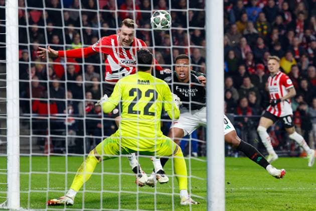 Luuk de Jong of PSV Eindhoven heads the ball, defends by Gabriel Arsenal FC, David Raya Arsenal FC , UEFA Champions League 2024 25 Round of 16 First Leg, PSV Eindhoven v Arsenal FC, Philips Stadion, March 4, 2025, Eindhoven, Netherlands.