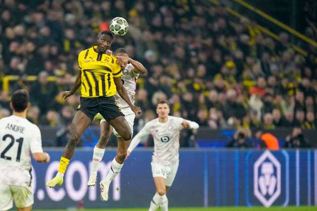 Serhou Guirassy (Borussia Dortmund) und Bafode Diakite (LOSC Lille) battle for the ball during the UEFA Champions League 2024 25 Round of 16 First Leg match between Borussia Dortmund and LOSC Lille at Signal Iduna Park on March 4, 2025 in Dortmund, Germany.