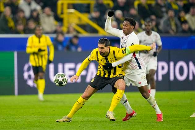 Emre Can (Borussia Dortmund) und Jonathan David (LOSC Lille) battle for the ball during the UEFA Champions League 2024 25 Round of 16 First Leg match between Borussia Dortmund and LOSC Lille at Signal Iduna Park on March 4, 2025 in Dortmund, Germany.