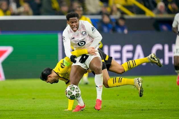 Emre Can (Borussia Dortmund) und Jonathan David (LOSC Lille) battle for the ball during the UEFA Champions League 2024 25 Round of 16 First Leg match between Borussia Dortmund and LOSC Lille at Signal Iduna Park on March 4, 2025 in Dortmund, Germany.
