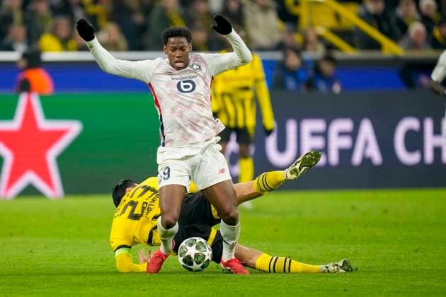 Emre Can (Borussia Dortmund) und Jonathan David (LOSC Lille) battle for the ball during the UEFA Champions League 2024 25 Round of 16 First Leg match between Borussia Dortmund and LOSC Lille at Signal Iduna Park on March 4, 2025 in Dortmund, Germany.