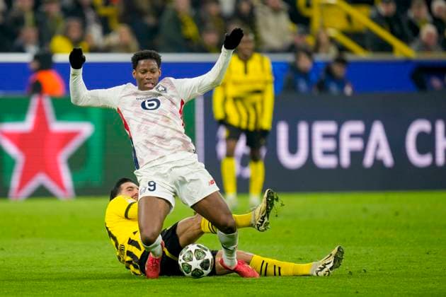 Emre Can (Borussia Dortmund) und Jonathan David (LOSC Lille) battle for the ball during the UEFA Champions League 2024 25 Round of 16 First Leg match between Borussia Dortmund and LOSC Lille at Signal Iduna Park on March 4, 2025 in Dortmund, Germany.