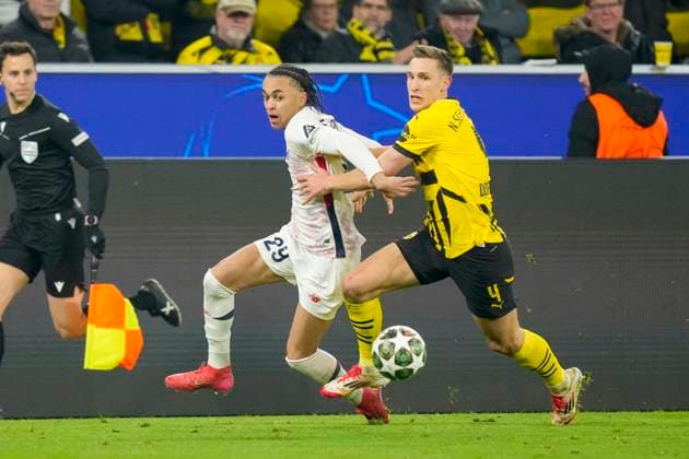 Ethan Mbappe (LOSC Lille) und Nico Schlotterbeck (Borussia Dortmund) battle for the ball during the UEFA Champions League 2024 25 Round of 16 First Leg match between Borussia Dortmund and LOSC Lille at Signal Iduna Park on March 4, 2025 in Dortmund, Germany.