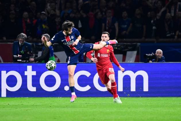 FOOTBALL : PSG vs Liverpool - Ligue des Champions - 05 03 2025 Khvicha Kvaratskhelia ( 7 - PSG ) and Andrew Robertson ( 26 - Liverpool ) during the UEFA Champions League match between Paris Saint Germain and Liverpool FC at Parc Des Princes on March 05 , 2025 in Paris, France. ( Photo by Dante Badano PsnewZ ) - ParisFrance  Copyright: xDantexBadanox