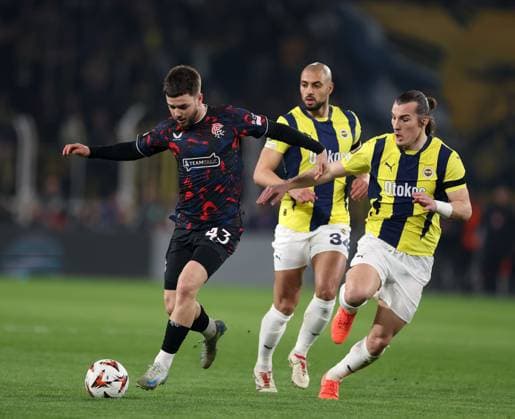 Nicolas Raskin of Rangers in action with Sofyan Amrabat and Caglar Soyuncu of Fenerbahce during the Europa League last 16 match at the Sükrü Saracoglu Stadium, Istanbul. Fenerbahce v Rangers, UEFA Europa League, Football, Sukru Saracoglu Stadium, Istanbul, Turkey - 06 Mar 2025 EDITORIAL USE ONLY No use with unauthorised audio, video, data, fixture lists, club league logos or live services. Online in-match use limited to 120 images, no video emulation. No use in betting, games or single club league player publications. Copyright: xO Rourke RangersxFC Shutterstockx 15182250ba