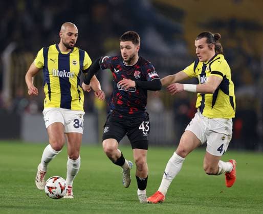 Nicolas Raskin of Rangers in action with Sofyan Amrabat and Caglar Soyuncu of Fenerbahce during the Europa League last 16 match at the Sükrü Saracoglu Stadium, Istanbul. Fenerbahce v Rangers, UEFA Europa League, Football, Sukru Saracoglu Stadium, Istanbul, Turkey - 06 Mar 2025 EDITORIAL USE ONLY No use with unauthorised audio, video, data, fixture lists, club league logos or live services. Online in-match use limited to 120 images, no video emulation. No use in betting, games or single club league player publications. Copyright: xO Rourke RangersxFC Shutterstockx 15182250az