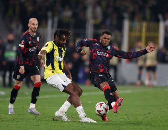 Dujon Sterling of Rangers in action with Allan Saint-Maximin of Fenerbahce during the Europa League last 16 match at the Sükrü Saracoglu Stadium, Istanbul. Fenerbahce v Rangers, UEFA Europa League, Football, Sukru Saracoglu Stadium, Istanbul, Turkey - 06 Mar 2025 EDITORIAL USE ONLY No use with unauthorised audio, video, data, fixture lists, club league logos or live services. Online in-match use limited to 120 images, no video emulation. No use in betting, games or single club league player publications. Copyright: xO Rourke RangersxFC Shutterstockx 15182250fm