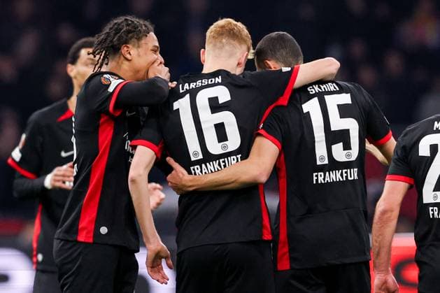 2025-03-06 AFC Ajax v Eintracht Frankfurt - UEFA Europa League 2024 25 Round of 16 First Leg AMSTERDAM, NETHERLANDS - MARCH 6: Hugo Larsson of Eintracht Frankfurt celebrates after scoring his teams first goal, Ellyes Skhiri of Eintracht Frankfurt, Jean-Matteo Bahoya of Eintracht Frankfurt during to the UEFA Europa League 2024 25 Round of 16 First Leg match between AFC Ajax and Eintracht Frankfurt at Johan Cruijff ArenA on March 6, 2025 in Amsterdam, Netherlands. Amsterdam Johan Cruijff ArenA Netherlands Content not available for redistribution in The Netherlands directly or indirectly through any third parties. Copyright: xBenxGalx