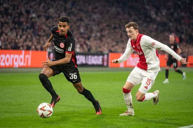 Amsterdam The Netherlands 6th March 2025 Football - UEFA Europa League knockout stage match AFC Ajax Amsterdam vs Eintracht Frankfurt in the Amsterdam Johan Cruijff Arena. Ansgar Knauff attacks for Frankfurt. Youri Baas defends game, match, wedstrijd, soccer