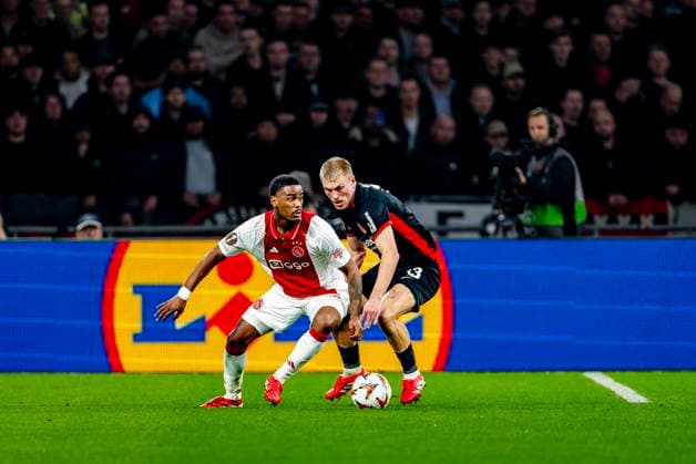 AFC Ajax Amsterdam defender Jorrel Hato, Eintracht Frankfurt defender Rasmus Kristensen during the match Ajax - Eintracht at the Johan Cruijff ArenA for the UEFA Europa League - Round of 16 - 1st leg season 2024-2025 in AMSTERDAM, Netherlands on 6 march 2025, (photo by Marcel van Dorst EYE4images DeFodi Images)