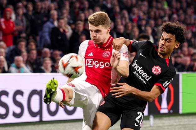 2025-03-06 AFC Ajax v Eintracht Frankfurt - UEFA Europa League 2024 25 Round of 16 First Leg AMSTERDAM, NETHERLANDS - MARCH 6: Anton Gaaei of AFC Ajax battles for possession with Nathaniel Brown of Eintracht Frankfurt during to the UEFA Europa League 2024 25 Round of 16 First Leg match between AFC Ajax and Eintracht Frankfurt at Johan Cruijff ArenA on March 6, 2025 in Amsterdam, Netherlands. Amsterdam Johan Cruijff ArenA Netherlands Content not available for redistribution in The Netherlands directly or indirectly through any third parties. Copyright: xBenxGalx