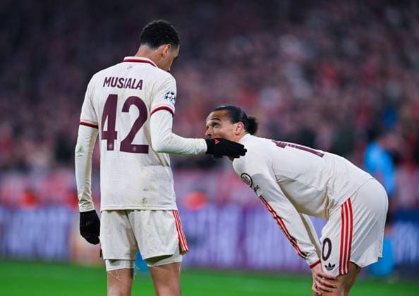 Leroy Sane (FC Bayern Muenchen) speaks to Jamal Musiala (FC Bayern Muenchen) during the UEFA Champions League 2024 25 Round of 16 First Leg match between FC Bayern München and Bayer 04 Leverkusen at Allianz Arena on March 5, 2025 in Munich, Germany. (Photo by Silas Schueller DeFodi Images)