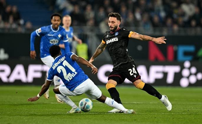 07.03.2025, xfux, Fussball 2.Bundesliga, SV Darmstadt 98 - Karlsruher SC v.l. Merveille Papela (SV Darmstadt 98), Fabian Schleusener (Karlsruher SC, KSC) (DFL DFB REGULATIONS PROHIBIT ANY USE OF PHOTOGRAPHS as IMAGE SEQUENCES and or QUASI-VIDEO. Eine Lizenzierung dieses Bildes an und oder durch den SV Darmstadt 1898 e.V. sowie Tochterunternehmen ist nicht gestattet. No release of or sale to SV Darmstadt 1898 e.V.) Darmstadt