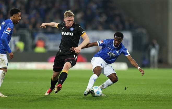 07.03.2025, xdcx, Fussball 2. Bundesliga, SV Darmstadt 98 - Karlsruher SC, emonline, emspor, despor, v.l., Mikkel Kaufmann (Karlsruher SC), Merveille Papela (SV Darmstadt 98) DFL DFB REGULATIONS PROHIBIT ANY USE OF PHOTOGRAPHS AS IMAGE SEQUENCES AND OR QUASI-VIDEO.
