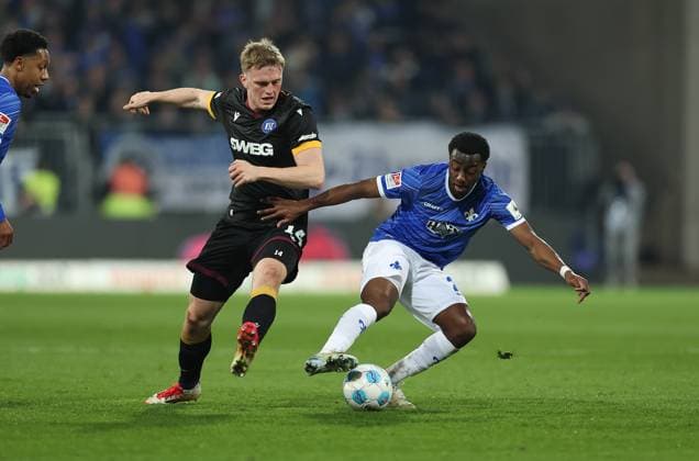 07.03.2025, xdcx, Fussball 2. Bundesliga, SV Darmstadt 98 - Karlsruher SC, emonline, emspor, despor, v.l., Mikkel Kaufmann (Karlsruher SC), Merveille Papela (SV Darmstadt 98) DFL DFB REGULATIONS PROHIBIT ANY USE OF PHOTOGRAPHS AS IMAGE SEQUENCES AND OR QUASI-VIDEO.