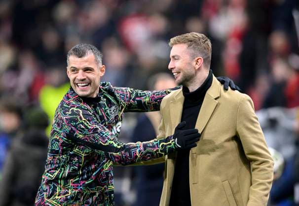 v.l. Granit XHAKA (LEV) , Christoph KRAMER (TV Experte) Begruessung, Fussball Champions League, 1 8 Finale Rueckspiel, Bayer 04 Leverkusen (LEV) - FC Bayern Muenchen (M), am 11.03.2025 in Leverkusen Deutschland. UEFA regulations prohibit any use of photographs as image sequences and or quasi-video Â