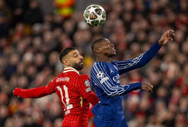 Football - UEFA Champions League - Round of 16 2nd Leg - Liverpool FC v Paris Saint-Germain FC LIVERPOOL, ENGLAND - Tuesday, March 11, 2025: Liverpool s Mohamed Salah (L) is challenged by Paris Saint-Germain s Nuno Mendes during the UEFA Champions League Round of 16 2nd Leg match between Liverpool FC and Paris Saint-Germain FC at Anfield. (Photo by David Rawcliffe Propaganda) LIVERPOOL Anfield MERSEYSIDE ENGLAND  Copyright: xDavidxRawcliffex P2025-03-11-Liverpool_PSG-26