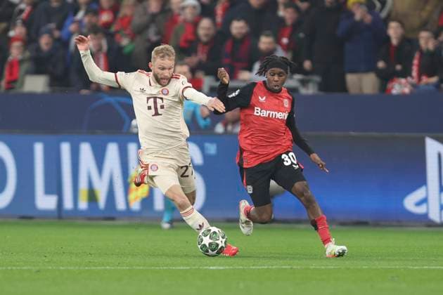 Konrad Laimer (FC Bayern München) und Jeremie Frimpong (Bayer 04 Leverkusen) battle for the ball during the UEFA Champions League 2024 25 Round of 16 Second Leg match between Bayer 04 Leverkusen and FC Bayern München at BayArena on March 11, 2025 in Leverkusen, Germany. (Photo by Oliver Kaelke DeFodi Images)