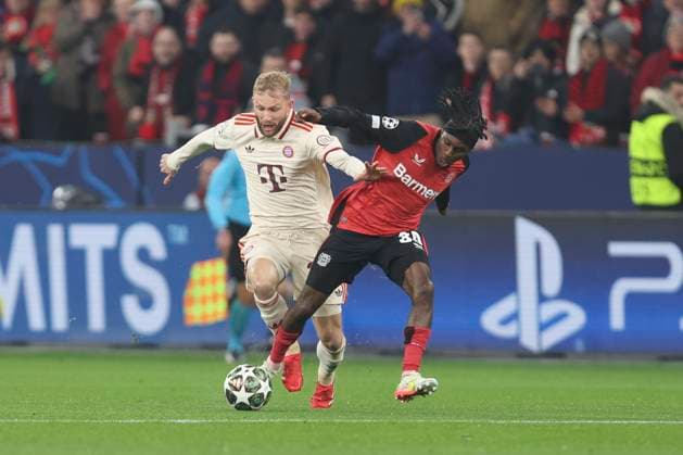 Konrad Laimer (FC Bayern München) und Jeremie Frimpong (Bayer 04 Leverkusen) battle for the ball during the UEFA Champions League 2024 25 Round of 16 Second Leg match between Bayer 04 Leverkusen and FC Bayern München at BayArena on March 11, 2025 in Leverkusen, Germany. (Photo by Oliver Kaelke DeFodi Images)