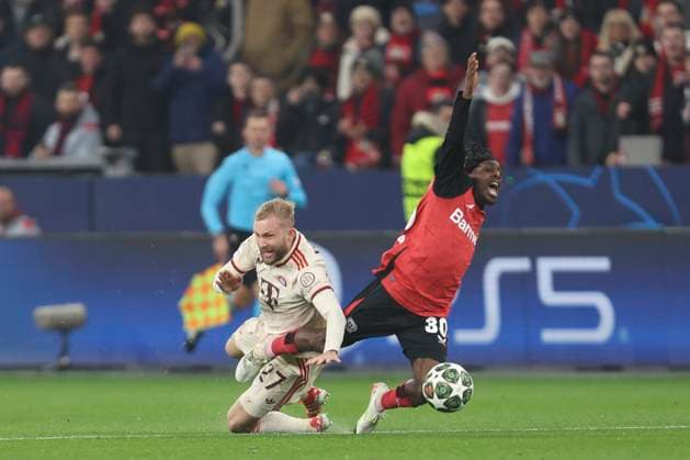 Konrad Laimer (FC Bayern München) und Jeremie Frimpong (Bayer 04 Leverkusen) battle for the ball during the UEFA Champions League 2024 25 Round of 16 Second Leg match between Bayer 04 Leverkusen and FC Bayern München at BayArena on March 11, 2025 in Leverkusen, Germany. (Photo by Oliver Kaelke DeFodi Images)