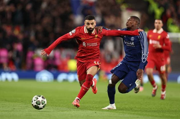 Mohamed Salah of Liverpool and Nuno Mendes Paris Saint-Germain Liverpool v Paris Saint-Germain, UEFA Champions League, Round of 16, Second Leg, Football, Anfield, Liverpool, UK - 11 Mar 2025 EDITORIAL USE ONLY No use with unauthorised audio, video, data, fixture lists, club league logos or live services. Online in-match use limited to 120 images, no video emulation. No use in betting, games or single club league player publications. Copyright: xRyanxBrowne Shutterstockx 15188180bb