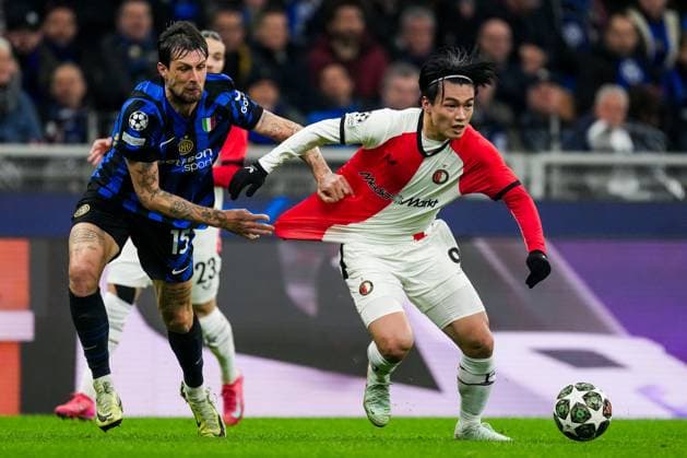 UEFA Champions League: FC Internationale Milan v Feyenoord Milan - Francesco Acerbi of FC Inter Milan, Ayase Ueda of Feyenoord during the 2nd leg of the round of 16 of new format of the Champions League 2024 2025. The match is set between FC Internationale Milan and Feyenoord at Giuseppe Meazza San Siro on 11 March 2025 in Milan, Italy. Copyright: xTomxBodex