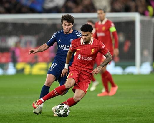 Liverpool, England, 11th March 2025. Luis Diaz of Liverpool with Joao Neves of Paris St Germain during the UEFA Champions League match Liverpool vs Paris Saint Germain at Anfield, Liverpool. Picture credit should read: Cody Froggatt Sportimage EDITORIAL USE ONLY. No use with unauthorised audio, video, data, fixture lists, club league logos or live services. Online in-match use limited to 120 images, no video emulation. No use in betting, games or single club league player publications. SPI_CF_041_Man_City_Real_Madrid SPI-3739-0041